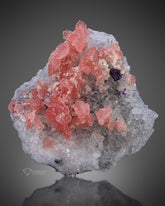 Rhodochrosite with fluorite on Quartz from China