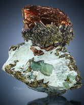 Axinite with epidote on Bysollite matrix