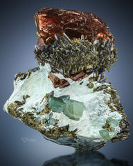 Axinite with epidote on Bysollite matrix
