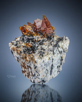 Synchysite with Riebeckite on matrix