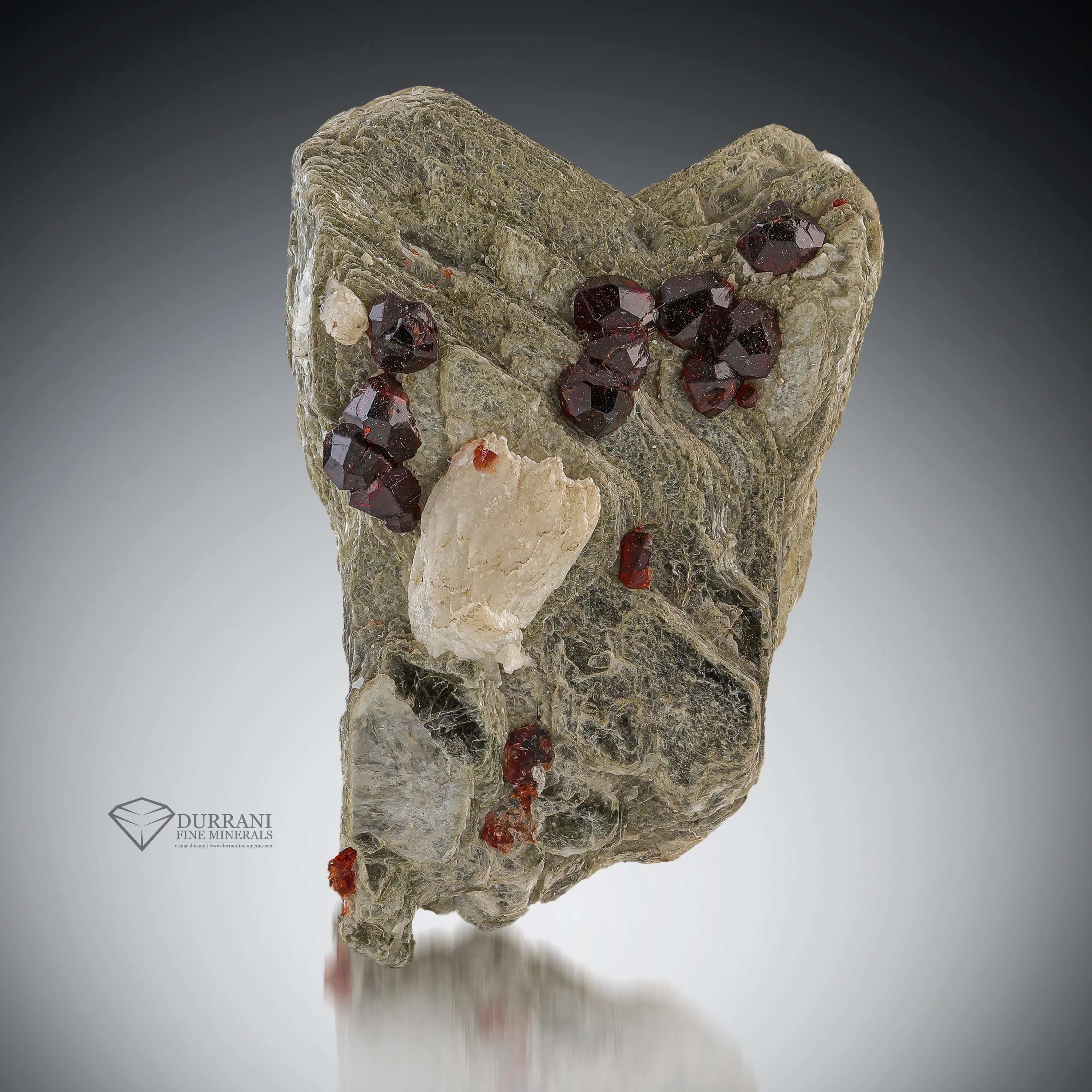 Spessertine Garnet With Mica And Feldspar