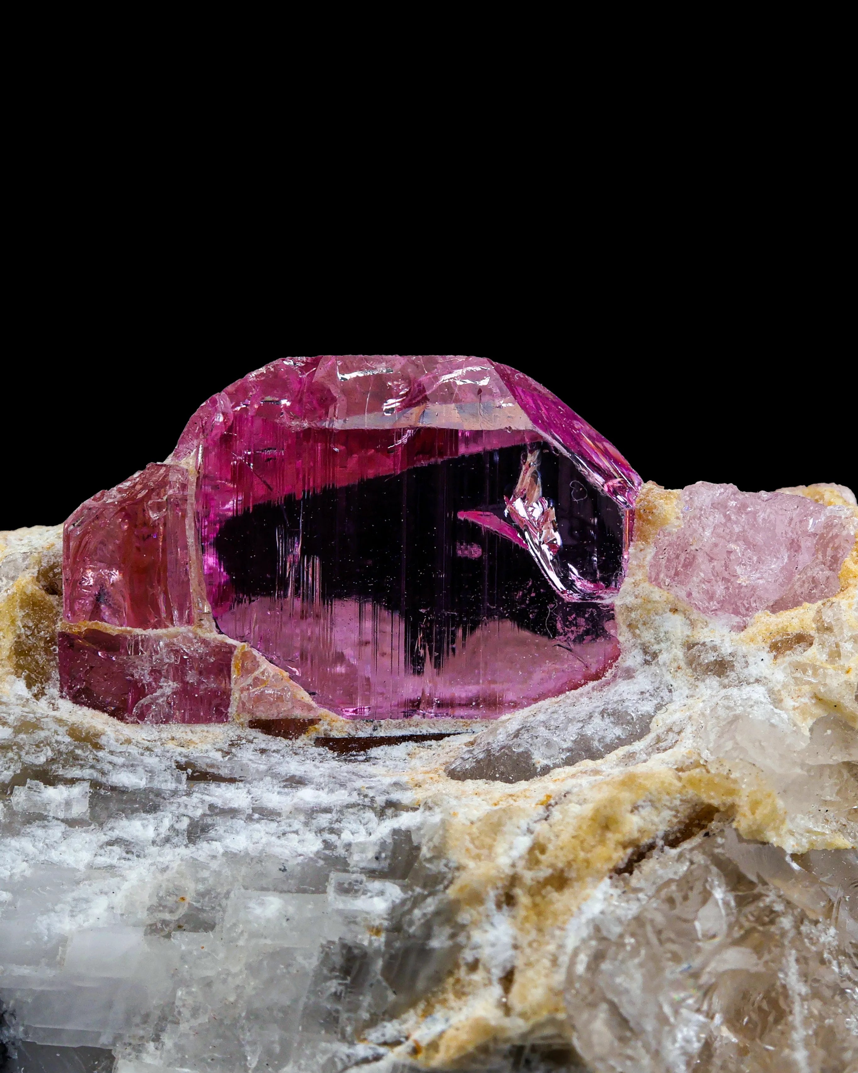 Pink colour Topaz crystal perched on Matrix