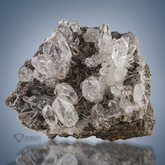 Diamond Quartz cluster perched on Calcite matrix.