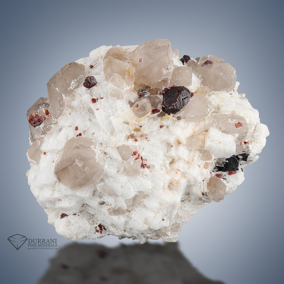 Lovely Spessertine Garnet with Quartz perched on Feldspar.