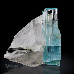 Aquamarine crystal with Quartz and schrol.