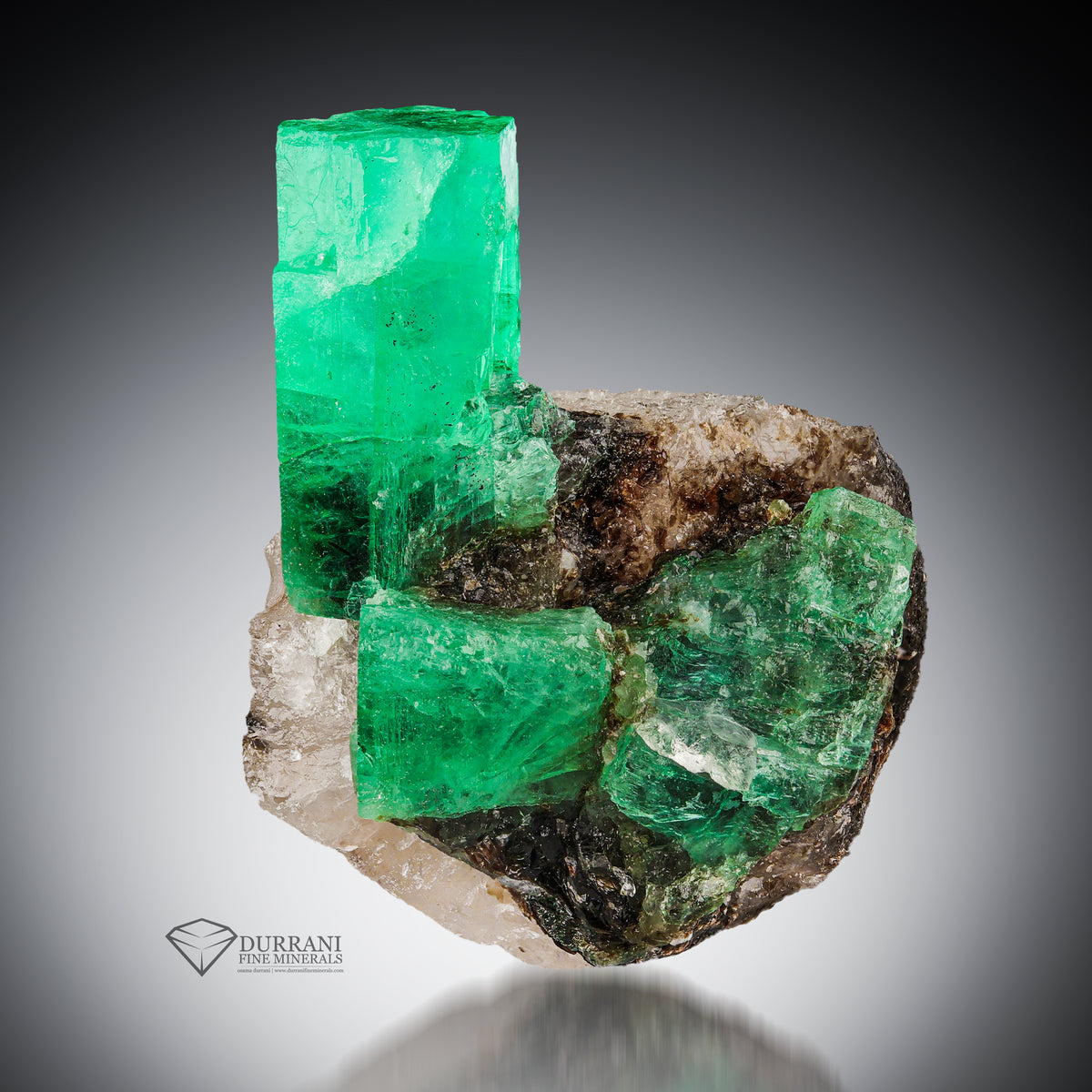 Interesting saturated colour Emerald crystal perched on calcite matrix