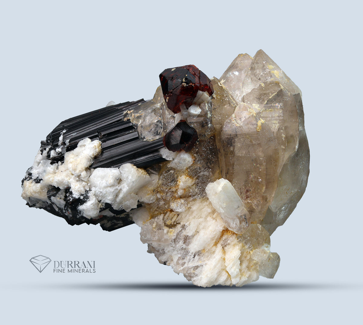 Spessertine Garnet with Schrol and Quartz