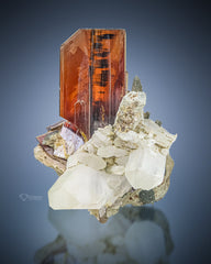 Terminated Brookite crystal perched on Quartz matrix