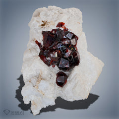 Spessertine Garnet bunch on feldspar