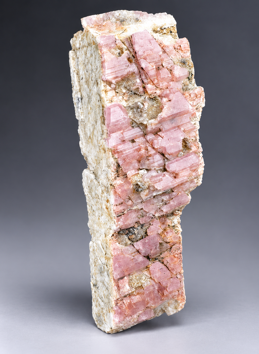 Pink Albite on Feldspar .