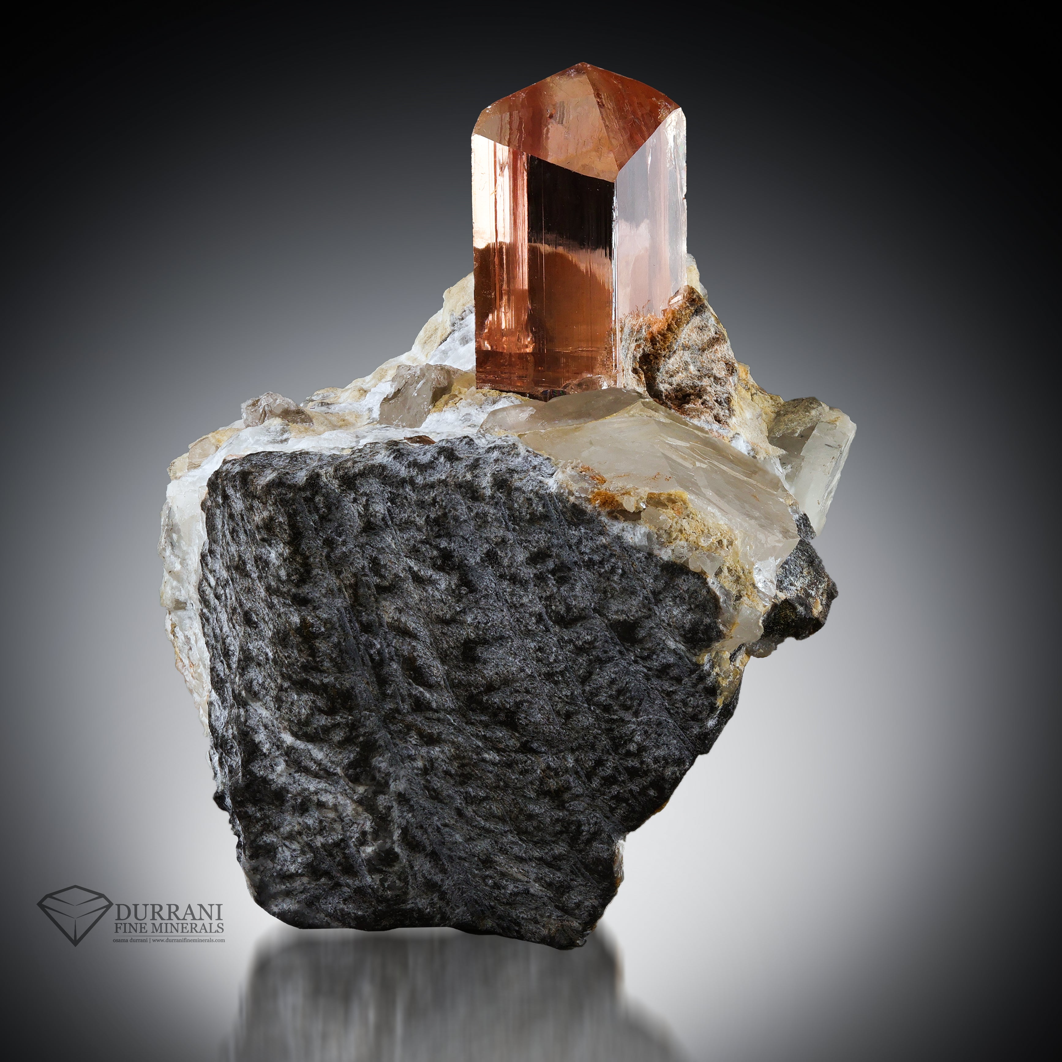 Clear Imperial Transparent Topaz crystal perched on Matrix