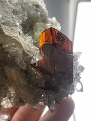 Red colour Brookite Crystals perched on Quartz matrix