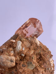 Clear Imperial Transparent Topaz crystal perched on Matrix