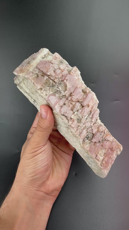 Pink Albite on Feldspar .